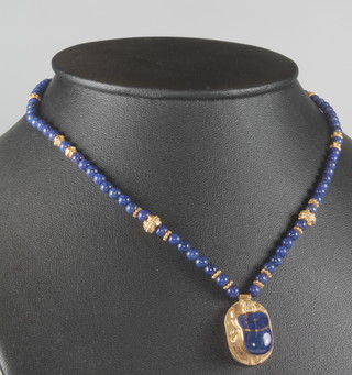 An 18ct yellow gold and lapis lazuli Egyptian style necklace 15" 