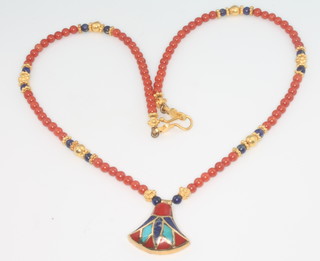 An 18ct yellow gold coral necklace in the Egyptian style 15" 