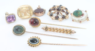 A Victorian cabochon cut garnet tie pin, 2 others, 3 seals and 3 brooches