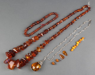 A natural amber bead necklace, 1 other and minor amber earrings and a pendant 