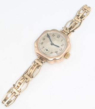 A lady's 9ct yellow gold Rolex wristwatch with seconds at 6 o'clock on a gilt bracelet London 1922