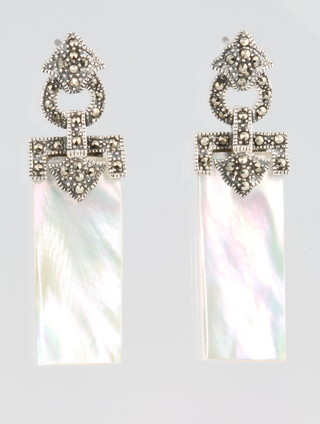A pair of silver paste and mother of pearl earrings