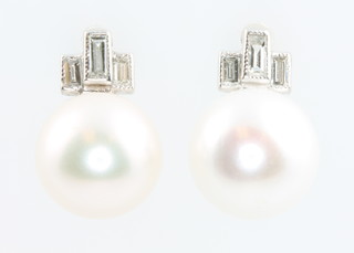 A pair of 18ct white gold cultured pearl and baguette diamond ear studs 