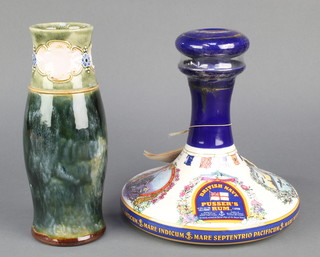 A Royal Doulton oviform vase, the green ground with a band of flowers and breaking cartouches 9" together with a Pusser's ceramic decanter containing Pusser's Rum 