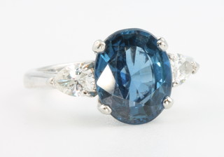 A platinum oval sapphire and diamond ring, size K 1/2