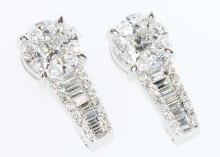 A pair of 18ct white gold marquise and baguette cut diamond ear clips approx. 1.5ct 