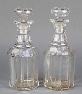 A pair of 19th Century mallet shaped decanters and stoppers with faceted necks 10 1/2" 