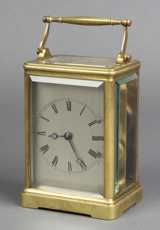 A 19th Century striking carriage clock with silvered dial, Roman numerals contained in a gilt metal case, the back plate marked Raingo France Paris no. 3253 4 1/2"h x 3"w x 2"d