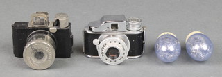 A Ucla miniature camera complete with instructions together with a Toyoca miniature camera 