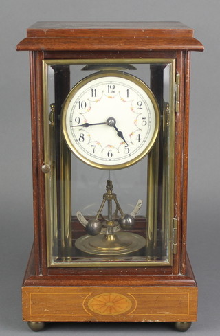 A 400 day style 4 glass torsion clock with enamelled dial and Arabic numerals contained in a mahogany and glass case 