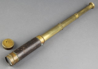 A brass and leather 3 draw pocket telescope