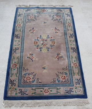 A blue and white ground Chinese rug with floral decoration 91" x 55" 