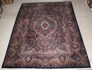 A Kashan blue ground carpet with central medallions 157" x 119" 
