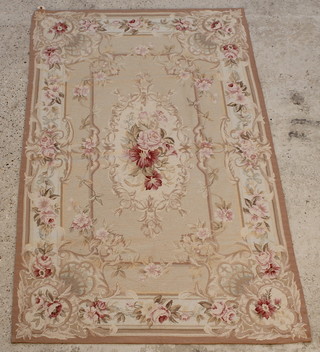 A yellow ground and floral patterned Aubusson style rug 74" x 48" 