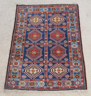 A blue ground Persian Yalameh rug formed of 8 panels 59" x 42" 