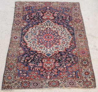 A blue and white ground Bakhtiari rug with central medallion 79" x 57"  