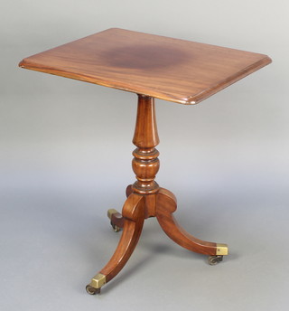 A 19th Century rectangular mahogany wine table, raised on pillar and tripod supports with brass caps and castors 28 1/2"h x 25"w x 20 1/2"d 