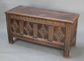 A 17th/18th Century coffer of panelled construction with hinged lid, fitted a candle box, 29 1/2"h x  57 1/2"w x 23"d 