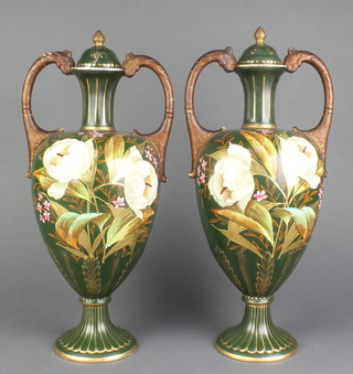 A pair of Victorian green ground 2 handled vases and covers with floral decoration 16" 