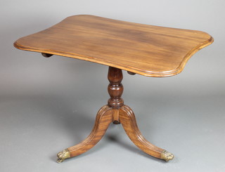 A Victorian shaped mahogany breakfast table, raised on pillar and tripod base with brass paw feet 28"h x 38"w x 28"d