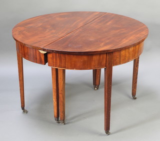 A 19th Century mahogany D end dining table, raised on 8 square tapered supports, brass caps and castors 29"h x 44"w x 43 1/2"l 