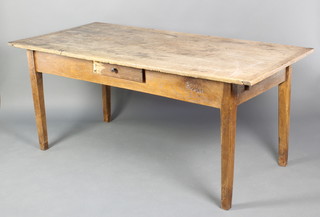A 19th Century rectangular Continental elm kitchen table the top of plank construction fitted 2 drawers, raised on square tapering supports 31"h x 34 1/2"w x 72"l  