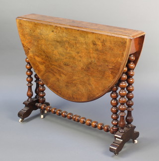 A Victorian quarter veneered figured walnut oval Sutherland table raised on bobbin turned supports 28"h x 33"w x 5 1/2" when closed x 40" when open 