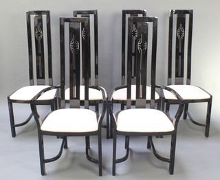 A set of 6 Charles Rennie Mackintosh style black lacquered high bar back dining chairs, comprising 2 carvers and 4 standard