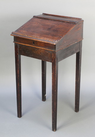 A 19th Century mahogany clerks slope with hinged lid, raised on square tapered supports 35 1/2"h x 18"w x 18 1/2"d 