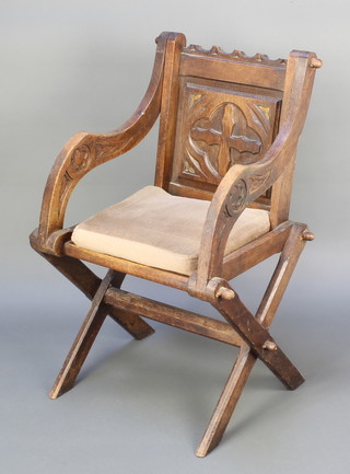 A Victorian carved oak Glastonbury chair 
