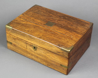 A Victorian rosewood and brass banded writing slope with fitted interior 5"h x 11 1/2"w x 8 1/2"d 
