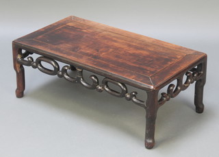 A rectangular Chinese hardwood table with carved and pierced apron 11"h x 30"w x 16"d 