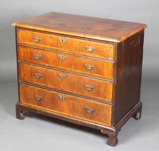 A Georgian figured walnut chest with quarter veneered and feather banded top, fitted 4 long graduated drawers with swan neck brass drop handles, raised on bracket feet 30"h x 33"w x 20"d 
