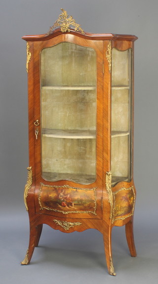A 20th Century Kingwood vitrine of serpentine outline, the plush interior fitted shelves with gilt metal mounts, the base with Louis Cannes style panels, raised on out swept supports 39"h x 31"w x 16"d 