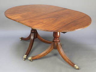 A Georgian style mahogany twin pillar D end dining table with 2 extra leaves, 28 1/2"h x 59"l with leaves 103"l x 22"w 