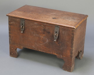 A 17th/18th Century coffer of plank construction with hinged lid and iron hasps, raised on bracket feet 20"h x 30 1/2"w x 16"d 