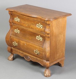 A Continental chest of serpentine outline and bombe form fitted 3 long drawers with brass swan neck drop handles, raised on cabriole ball and claw supports 26 1/2"h x 29 1/2"w x 15 1/2"d 
 