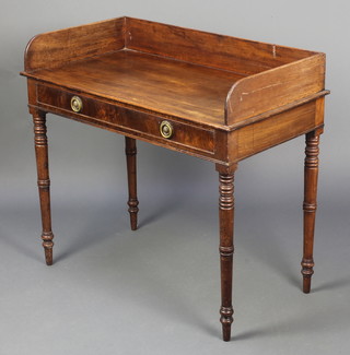 A Victorian mahogany wash stand with three-quarter gallery fitted 1 long drawer, raised on turned supports 32"h x 35 1/2" x 19 1/2"d 