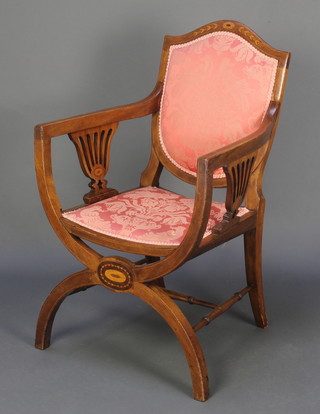 An Edwardian Italian style inlaid mahogany shield back open arm chair raised on X framed supports, inlaid throughout