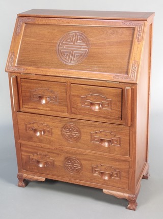 A Chinese carved Padouk bureau, the fall front revealing a well fitted interior above 2 short and 2 long drawers, raised on bracket feet 42"h x 30"w x 16"d 
