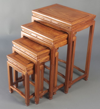 A nest of 4 Chinese rectangular carved Padouk interfitting coffee tables 27 1/2"h x 19" x 13 1/2", 23 1/2" x 16" x 11 1/2", 19 1/2"h x 13 1/2"w x 9 1/2" and 15 1/2"h x 10 1/2w x 7 1/2"d  