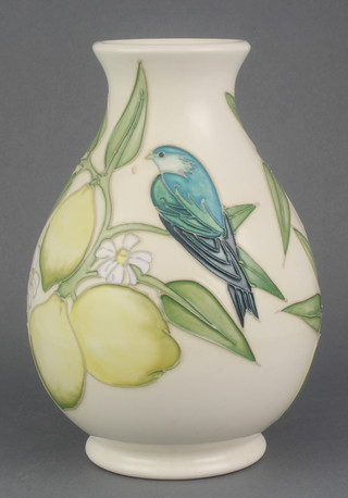 A modern Moorcroft cream ground baluster vase decorated with a bird amongst lemons and leaves 8" 