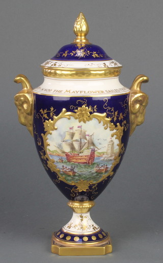 A Coalport commemorative vase and cover to celebrate the 350th Anniversary of the Sailing of the Mayflower 1620-1970, decorated by Richard Budd, the dark blue ground with maritime panel and having gilt ram's head handles 10" 
