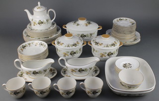 A Royal Doulton Larchmont pattern tea/dinner service, comprising teapot, 8 tea cups, 8 saucers, sugar bowl, 10 small plates, 8 medium plates, 7 large plates, 8 soup bowls, 2 sauce boats and stands, 3 tureens and lids, 3 sandwich plates and 2 casseroles 