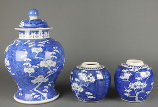 A Chinese prunus baluster vase and cover 12" together with a pair of prunus ginger jars
