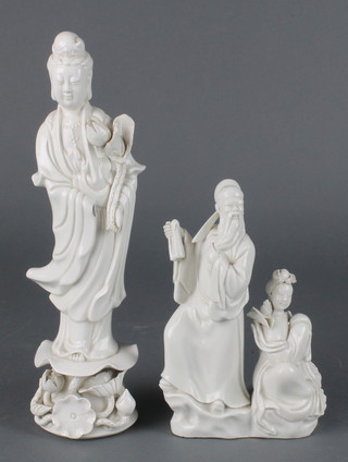 A 19th century Chinese blanc de chine figure of a standing scholar holding a scroll beside a seated lady 6 1/2"  signed, together with a ditto figure of Guanyin 10" 