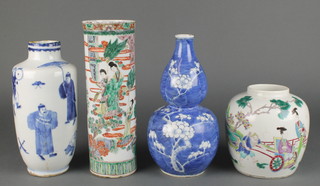 A 19th Century Chinese famille vert cylindrical vase decorated with figures at pursuits in a garden setting with Kangxi mark 9 1/2" together with a Chinese blue and white oviform vase decorated with figures at pursuits 8 1/2", a famille verte ginger jar decorated with a figure in a chair in a procession 6" and a blue and white prunus gourd shaped vase 9" 