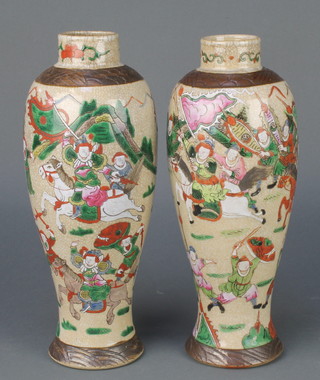 A pair of Chinese oviform crackle glazed vases decorated with fighting scenes 12" 