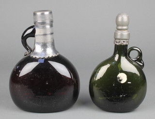 A 19th Century Continental brown glass bottle with pewter mounts 8 1/2", a green ditto 8 1/2" 