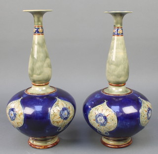 A pair of Royal Doulton baluster vases with tapered necks and floral motifs 16"